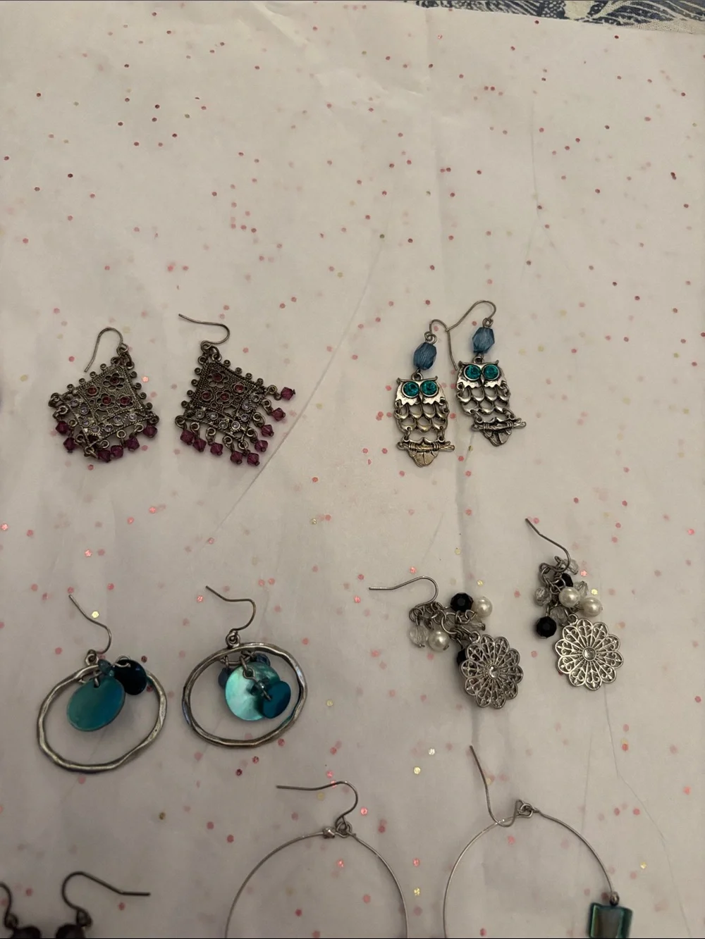 10 pair of assorted‎ earrings.